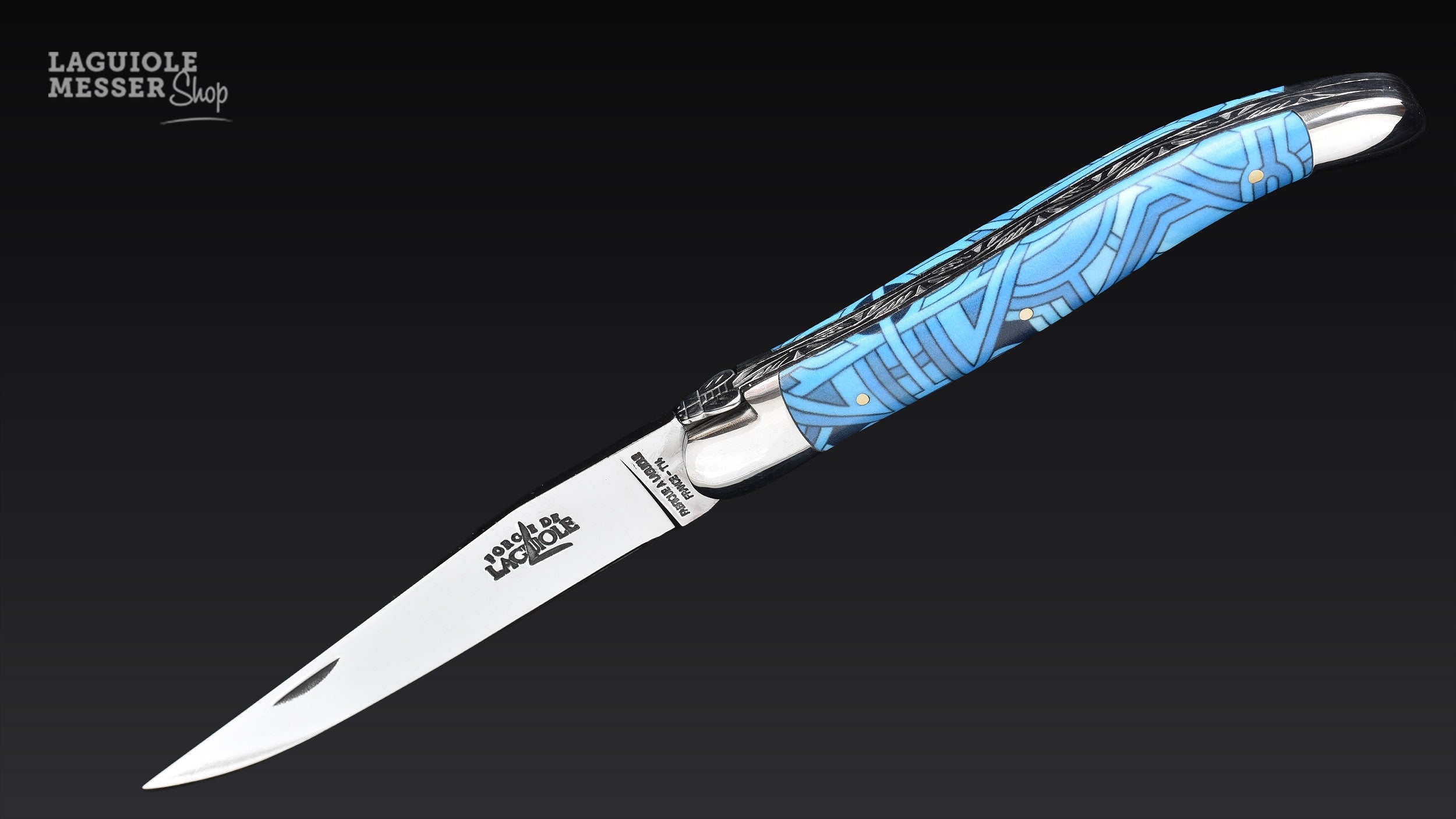 Laguiole Taschenmesser Vega aus der Sonderserie «Happy Wallmaker» von Seize mit blauem Griffdekor und geöffneter Klinge