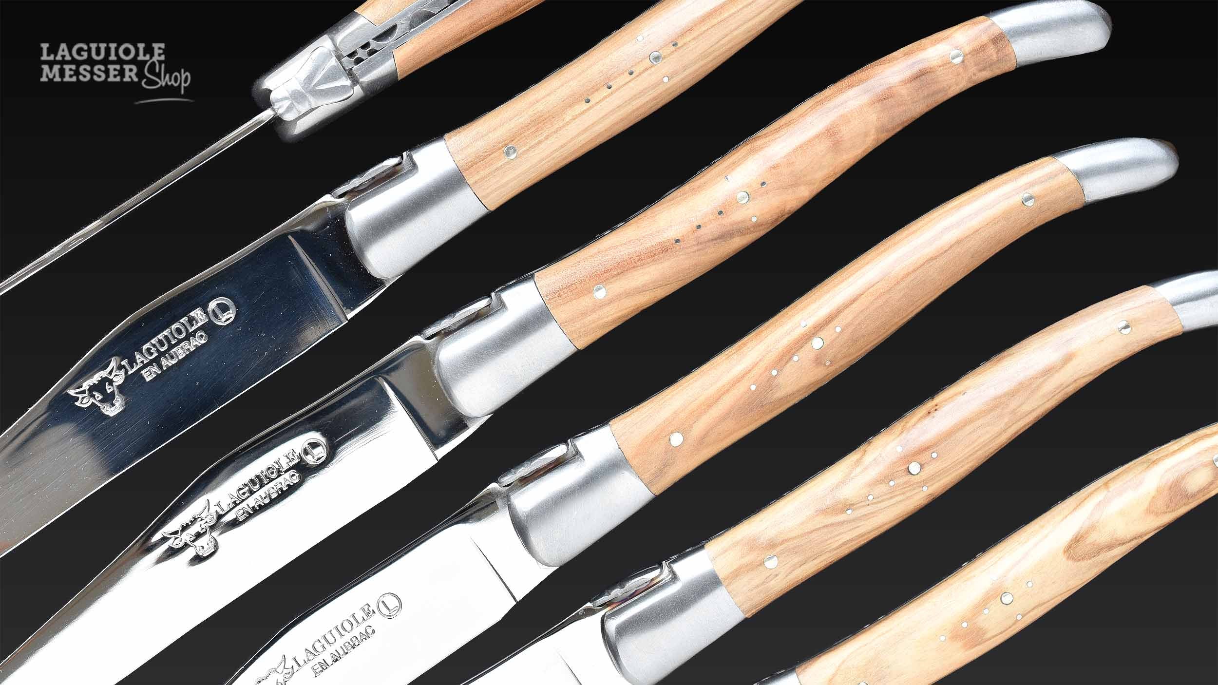 Laguiole en Aubrac, Details des Steakmesserset mit polierter Klinge und satinierter Mouche, Olivenholz