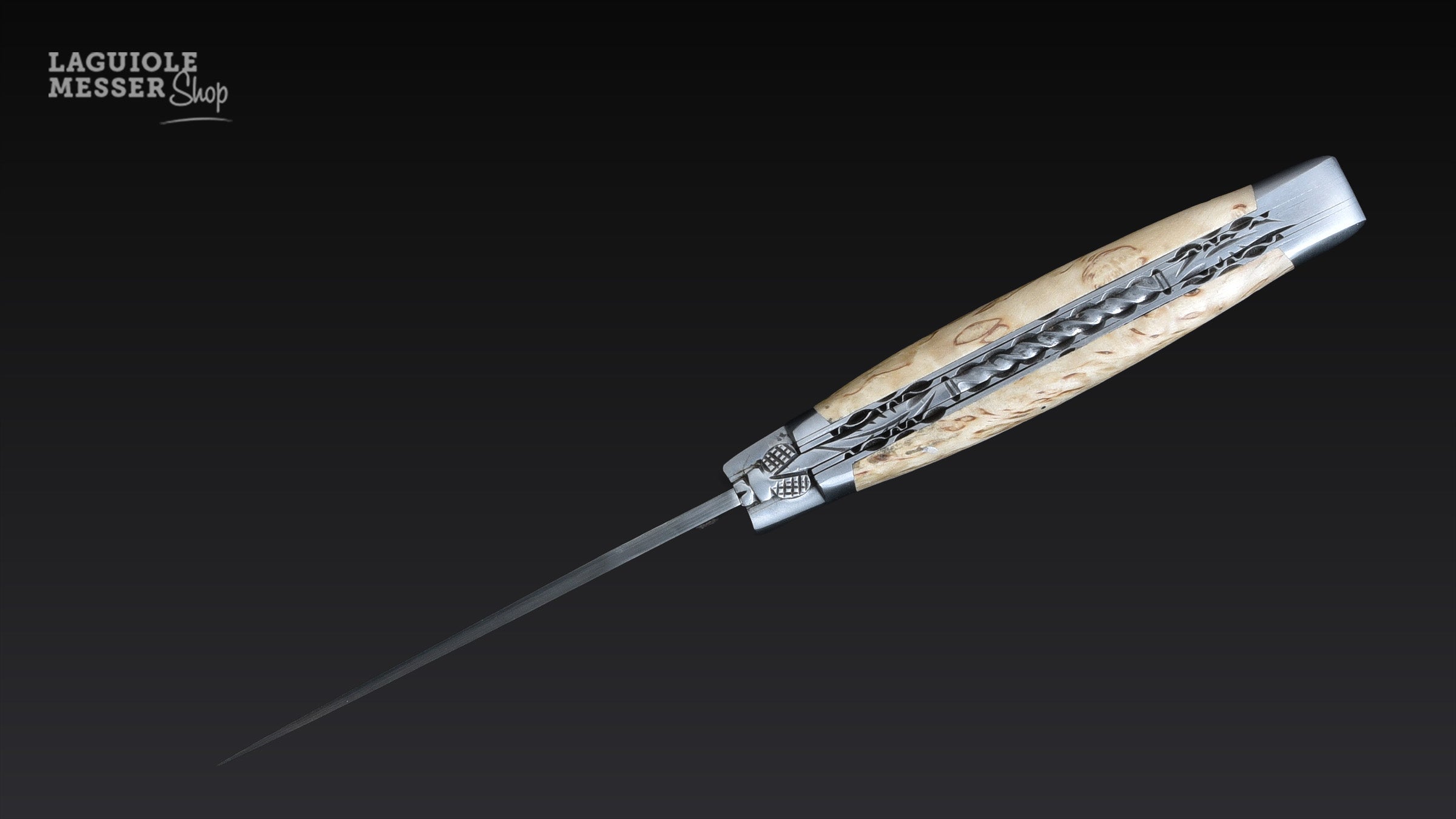 Griff aus Birkenholz mit feiner Maserung  und Laguiole en Aubrac Doppelplatine torsadée